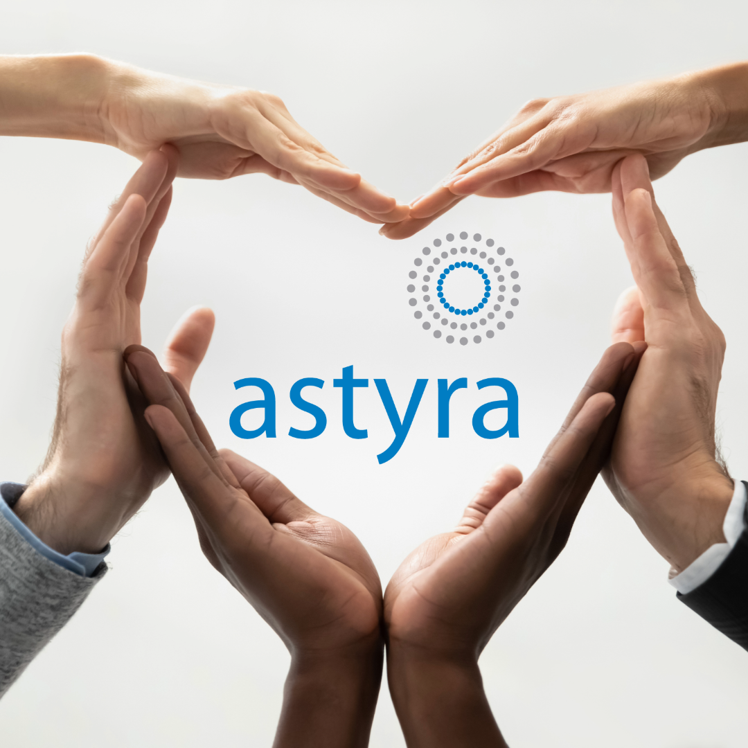 Image of several hands forming a heart with Astyra's logo in the center