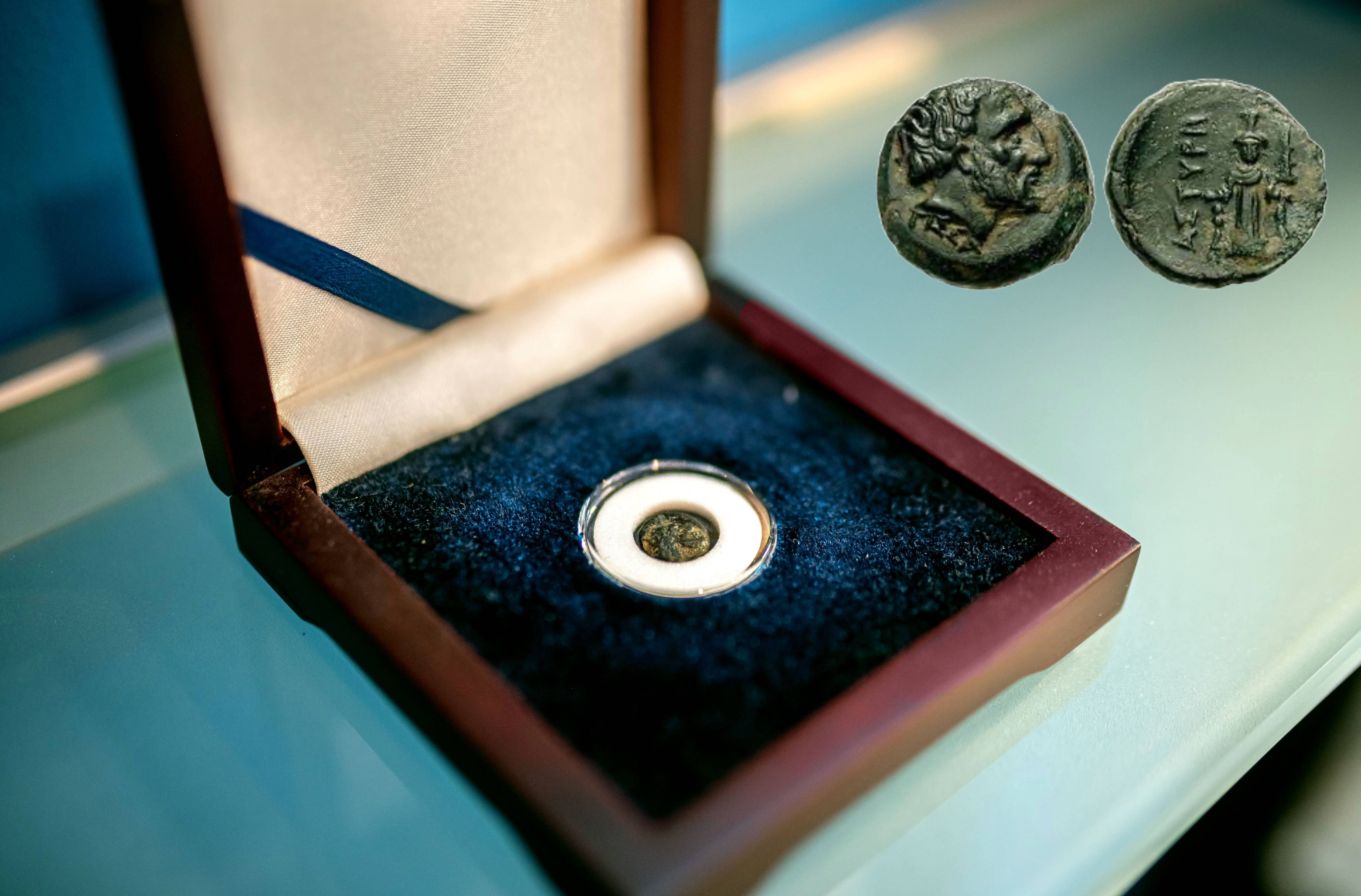 Photo of real Astyra coin located in our Richmond office